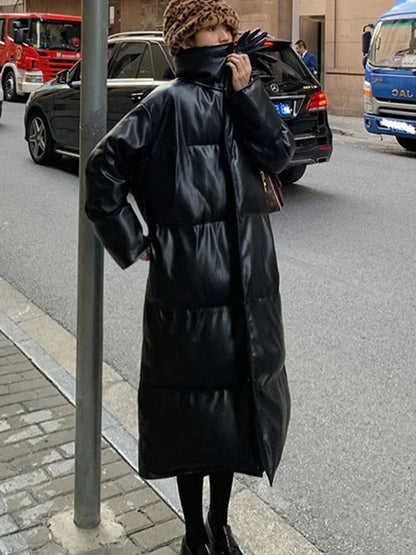 Aimee – lange leder-pufferjacke mit gürtel